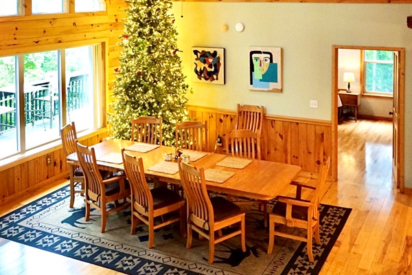 Dining Room: Gather around the spacious table, adorned with art and a festive tree for joy!