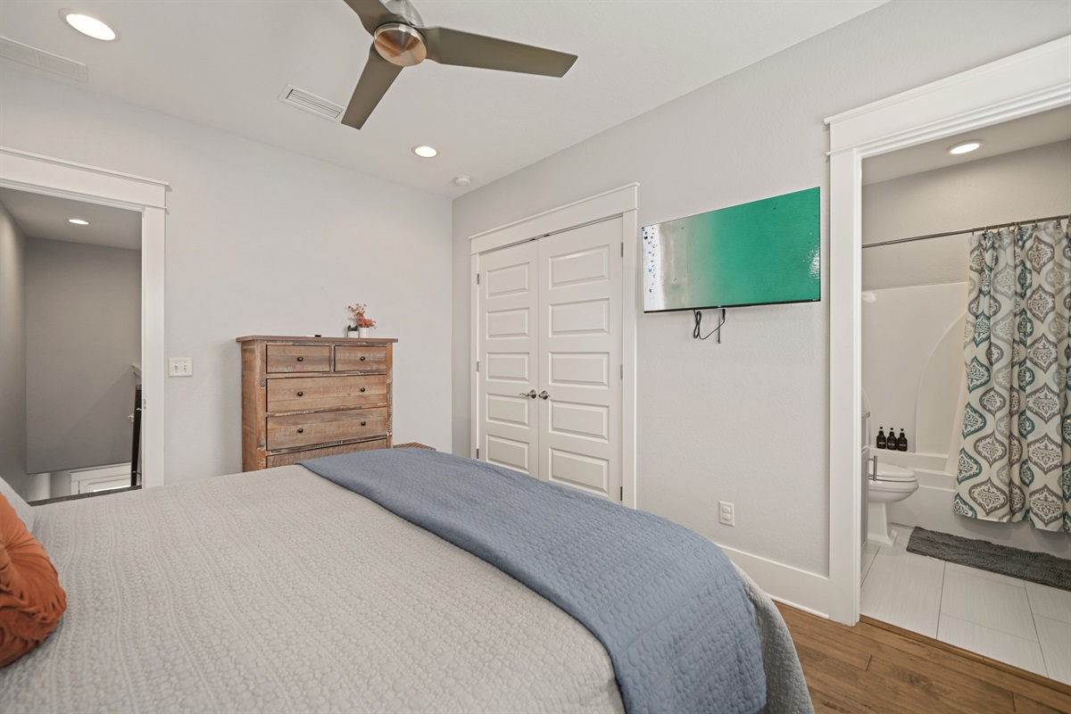 King Suite featuring a plush king bed and wall-mounted TV