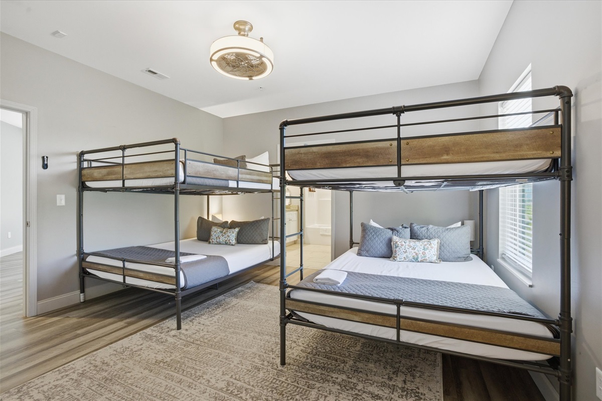This room was made for a crew—three queen-over-queen bunks means everyone has a real spot. Pick your level, claim it early, and let this be the place everyone circles back to.