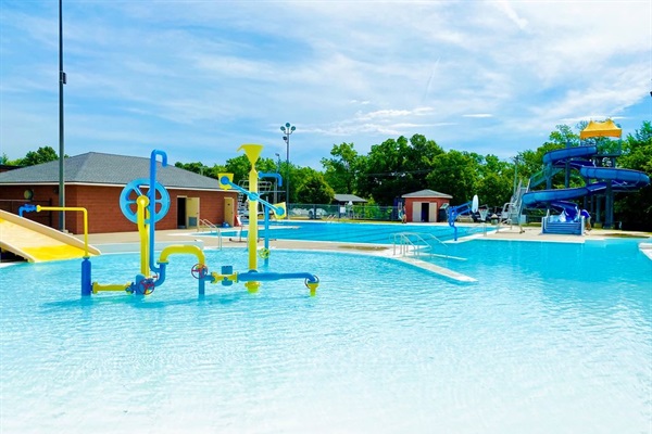 Aquatic Center open Memorial Day to Labor Day. $5/per day per person.  Just one block South of home.