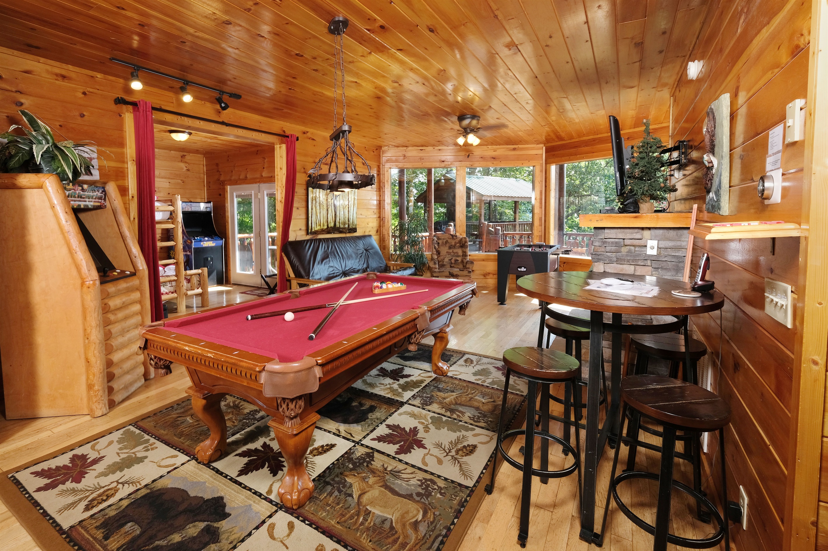 Game area, pool table, TWO arcades, and foosball