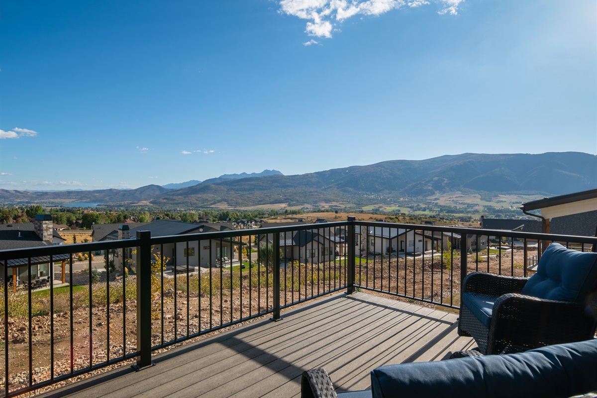 Expansive deck with breathtaking mountain views—perfect for relaxing outdoors.