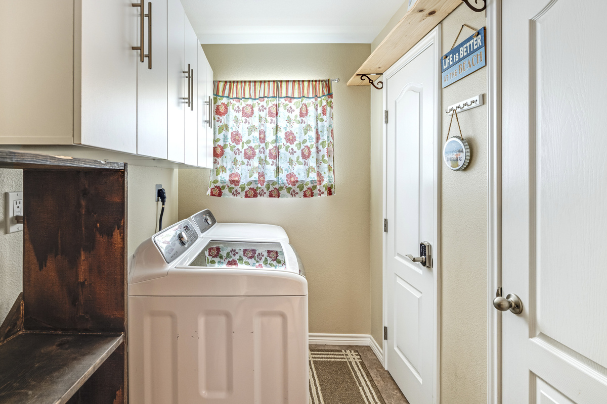 Laundry Room:  Full Size Washer and Dryer.  Additional Storage.