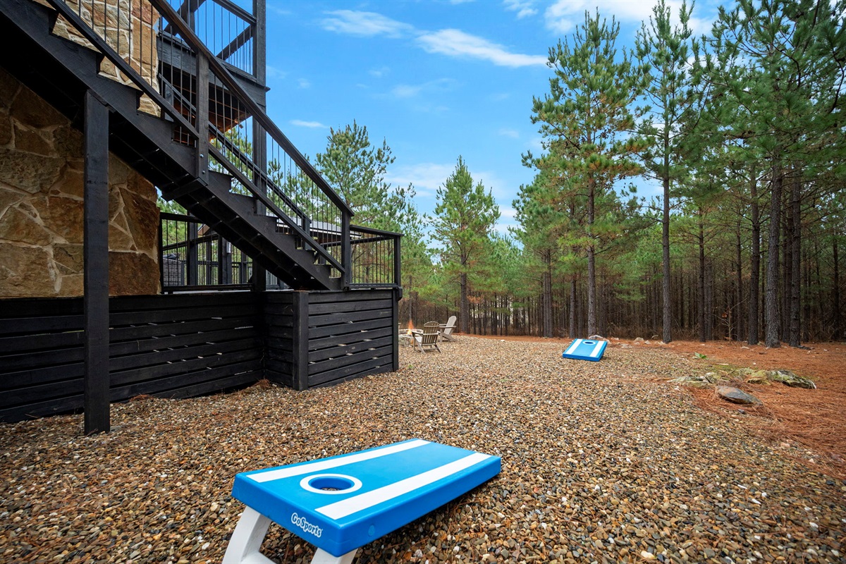 Cornhole games on a private wooded lot 🎯
