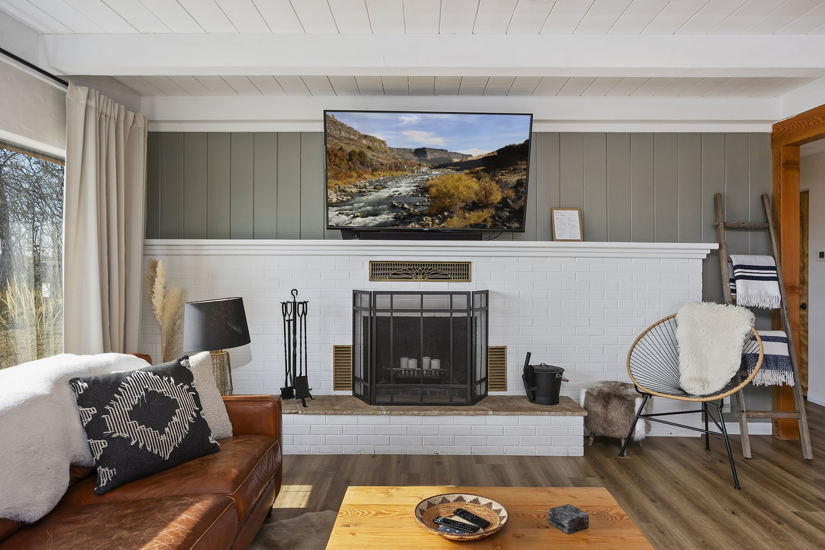 Unit 2 living room — bright, comfortable, with country views