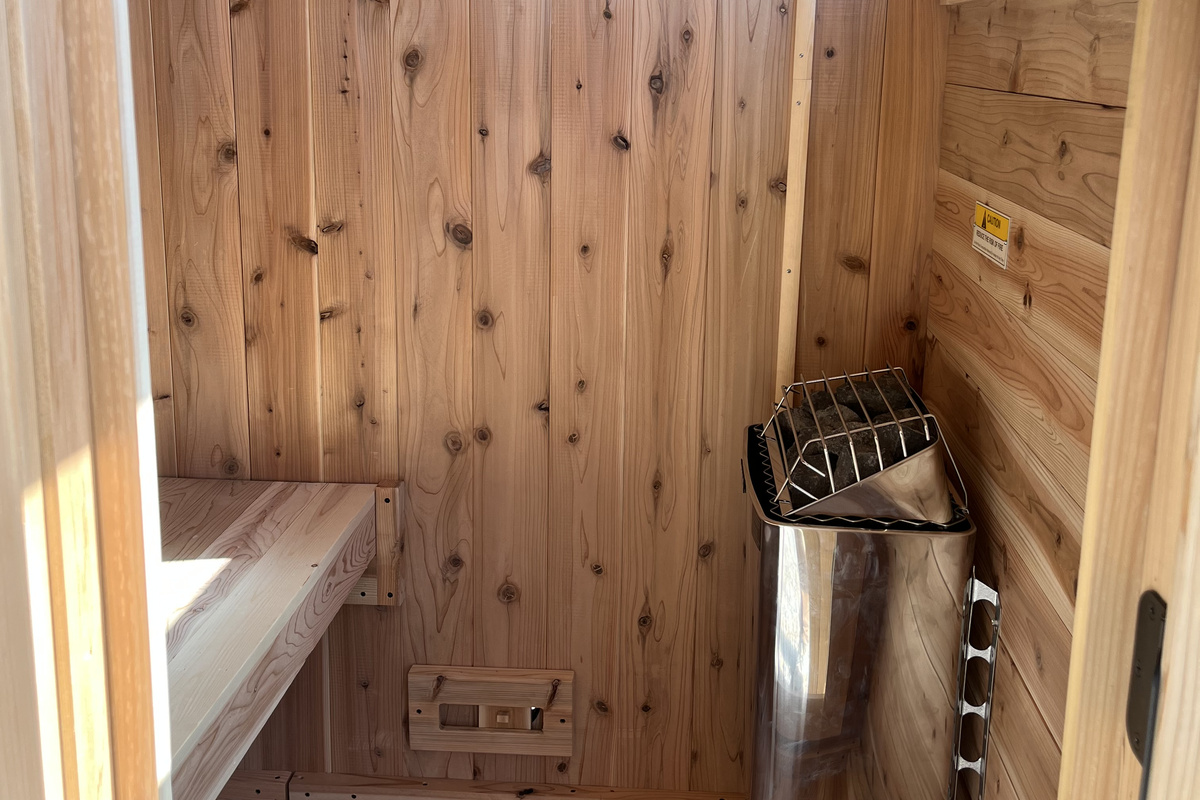 Step inside the private wood-lined sauna and unwind in a warm, relaxing space after a day of adventure.
