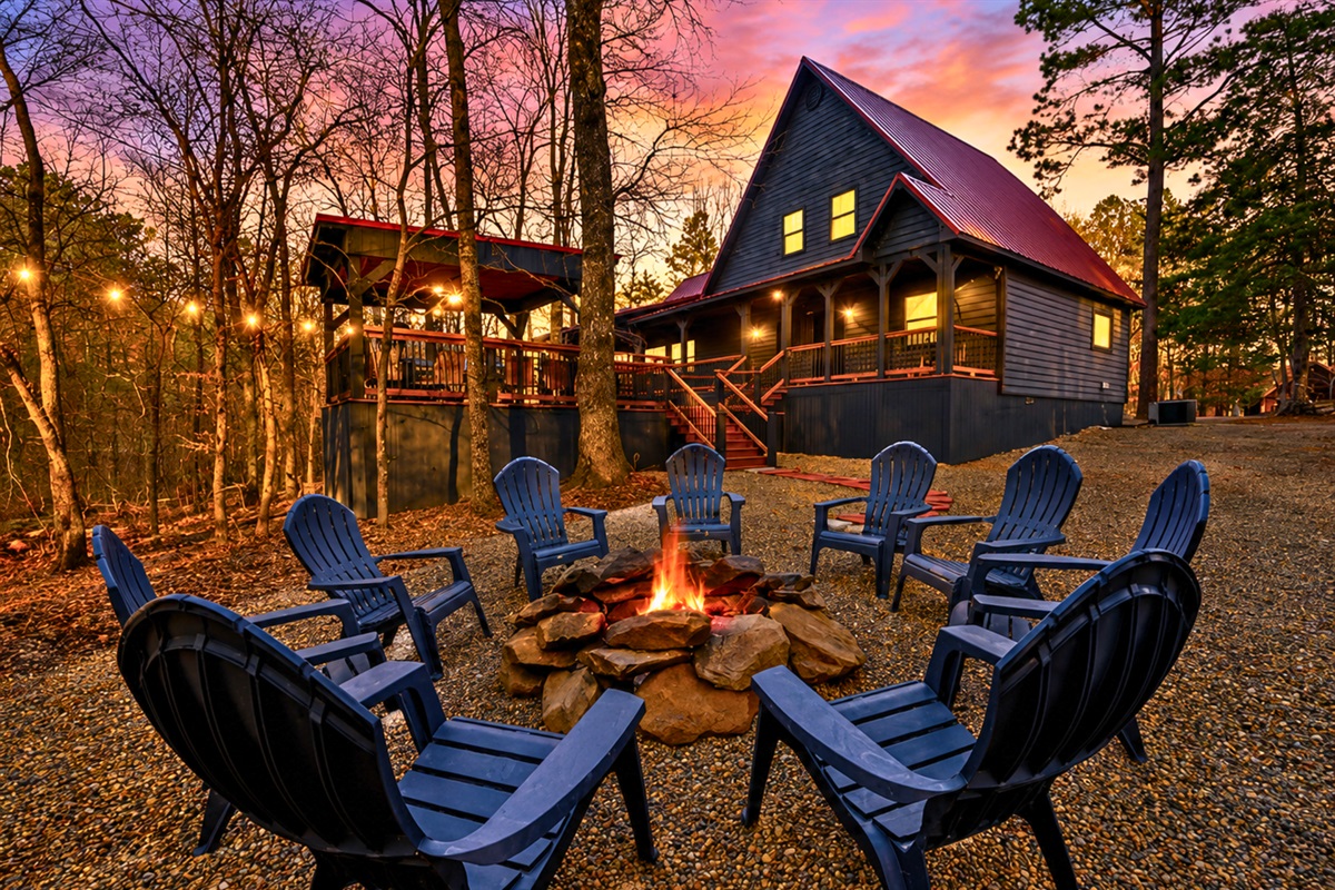 Evenings around the fire pit feel extra cozy here, with glowing string lights, towering trees, and plenty of seating for the whole group.