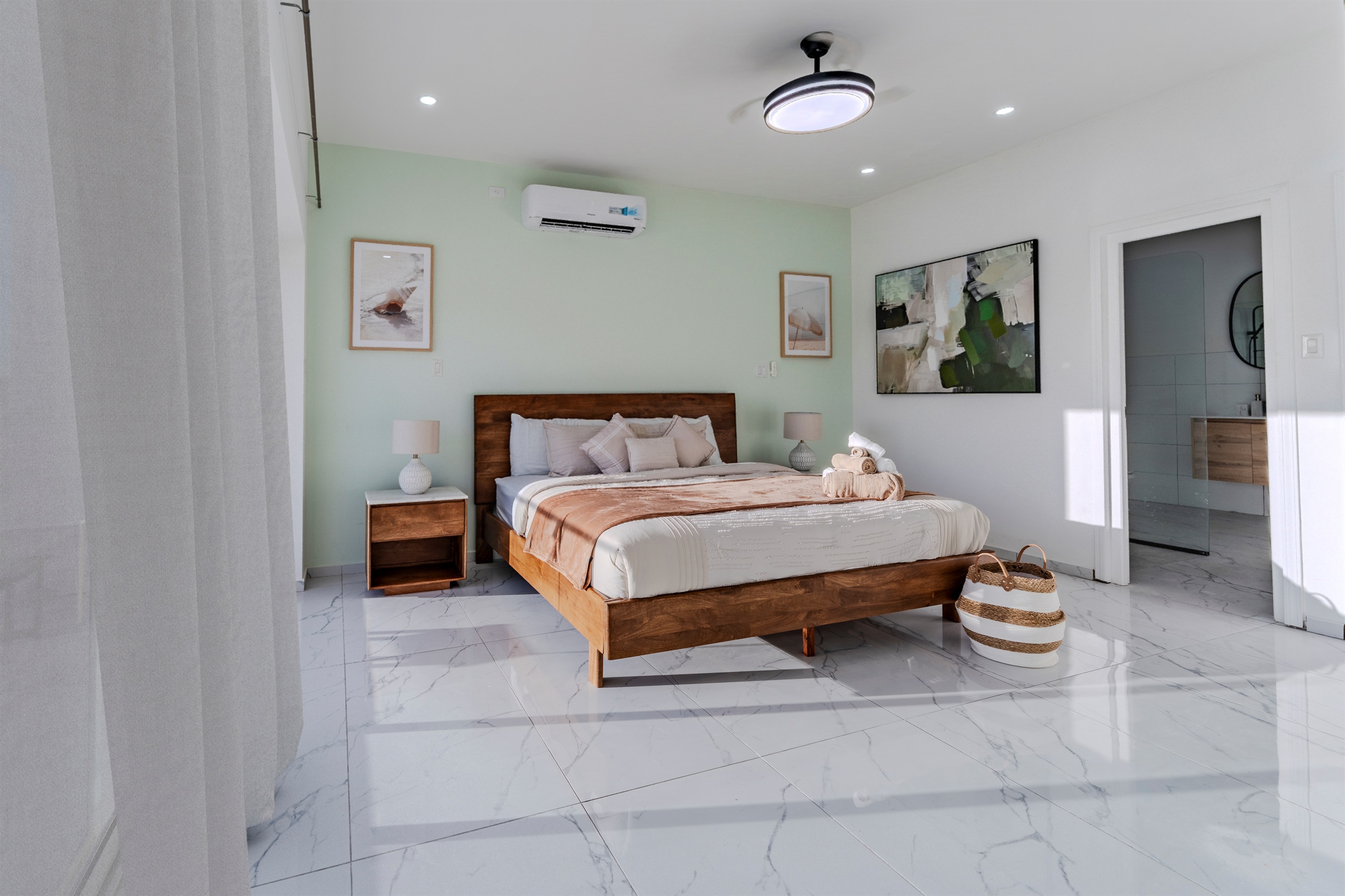 Elegant Bedroom with Plush Bedding & Sheer Floor‑to‑Ceiling Curtains