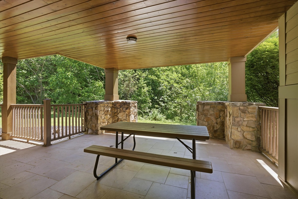 Step out onto the covered porch and enjoy fresh mountain air from your own picnic table, perfect for morning coffee or a relaxed meal outside.