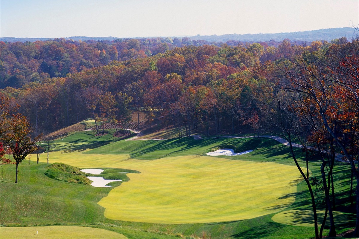 Embrace the Challenge: Navigate the scenic Ozark hills on our stunning golf course.