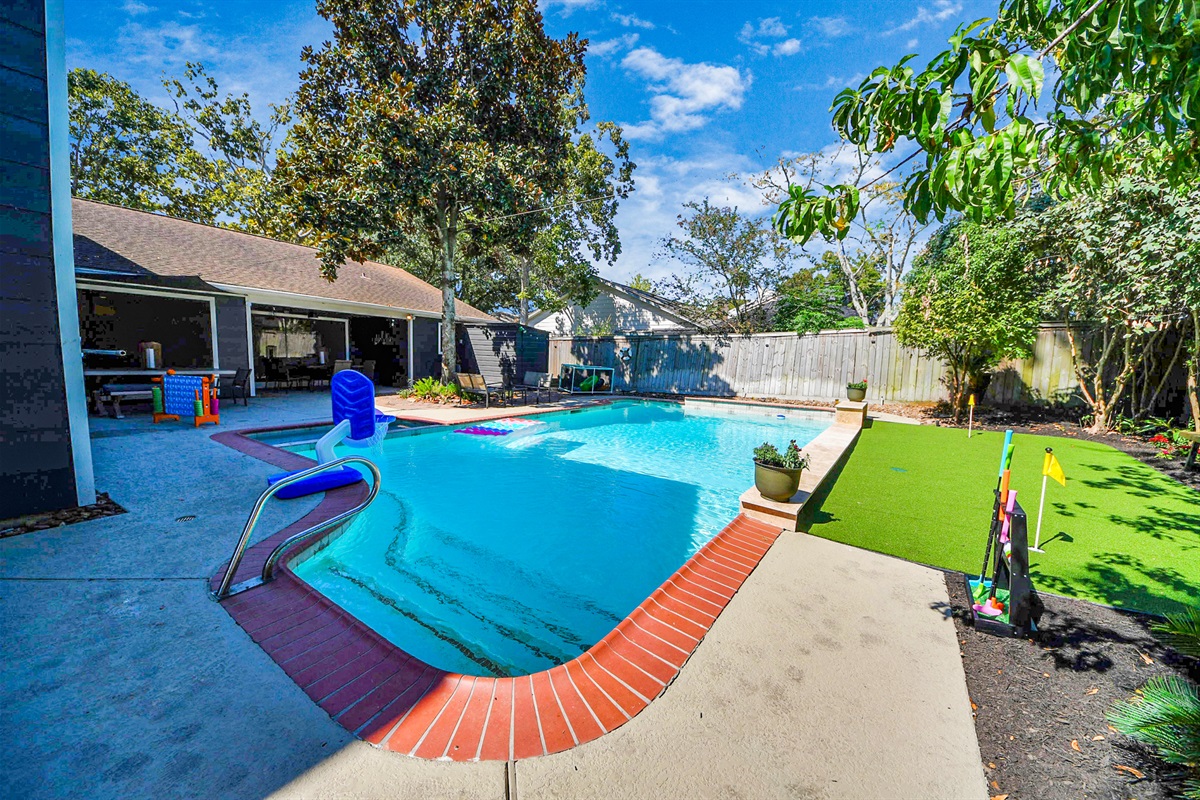 Plenty of fun to be had in this backyard with a sparkling pool, putting green, connect 4 and places to sit and soak in the sun or read a book!