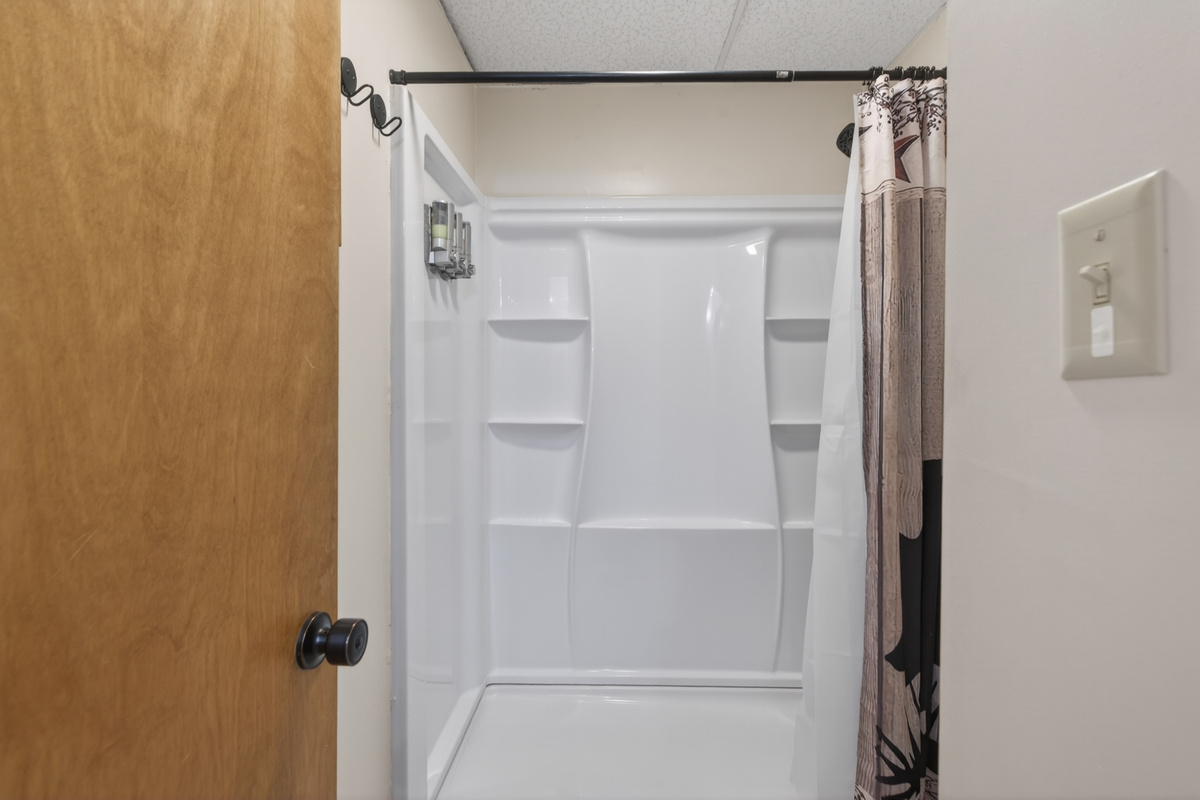 Modern Bathroom: Refresh after adventure in this sleek, bright space with ample storage!