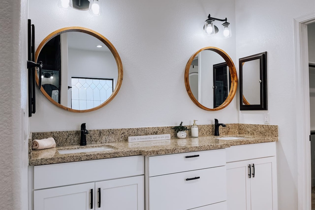 Master suite bathroom featuring dual sinks and ample counter space