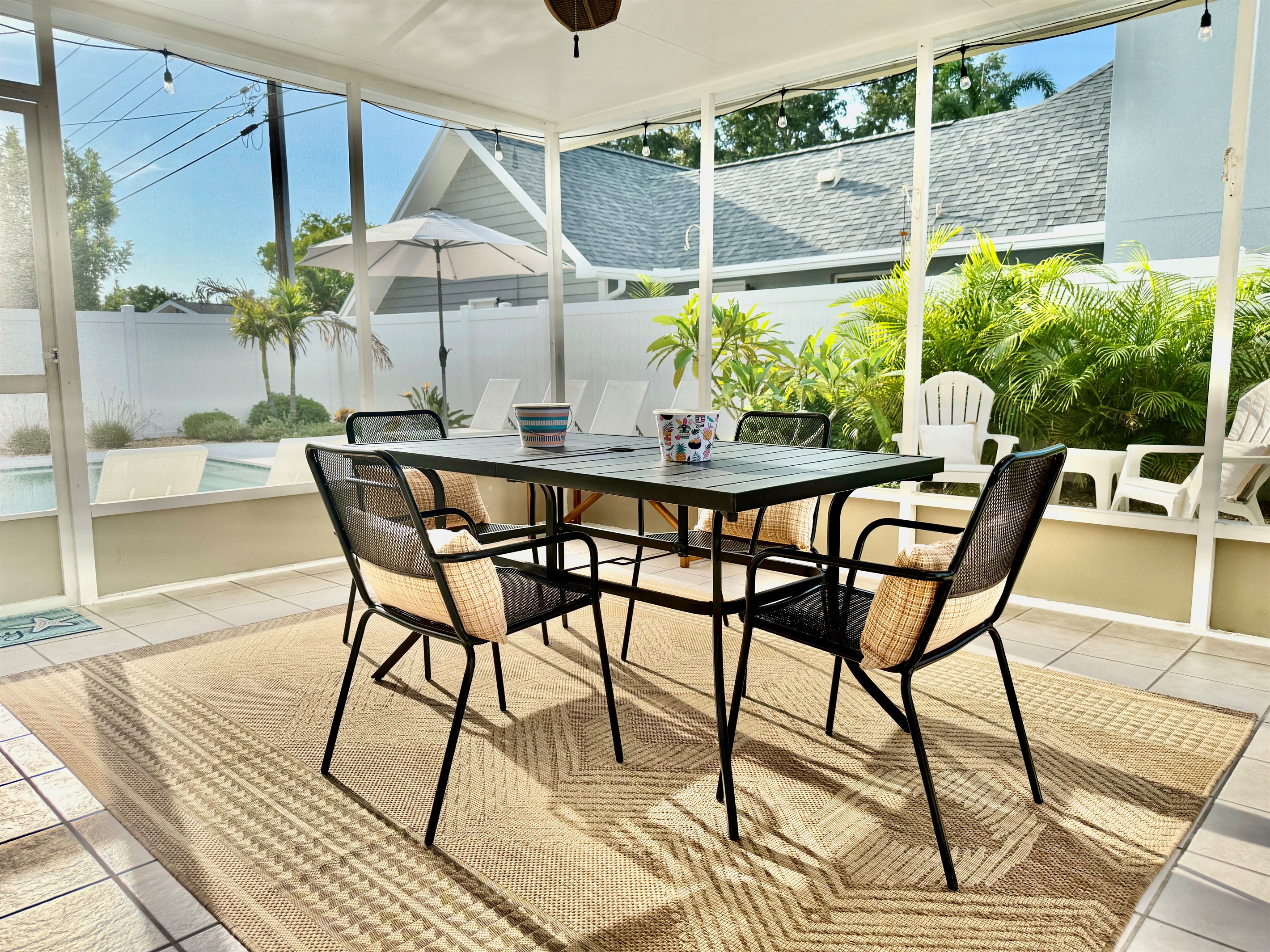 With chic patio furniture, lush greenery, and a crystal-clear heated pool, you won’t want to leave this backyard.
