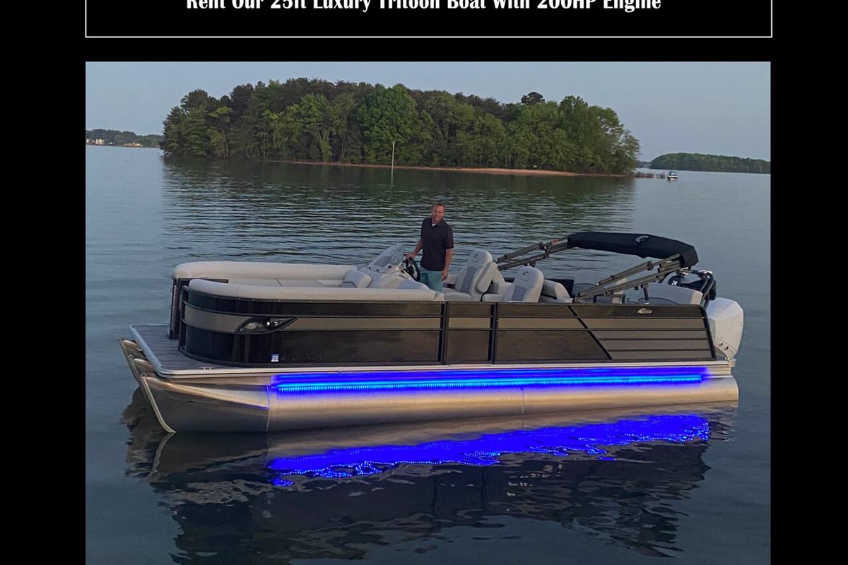 Our pontoon boat located at the dock available for guests to rent.