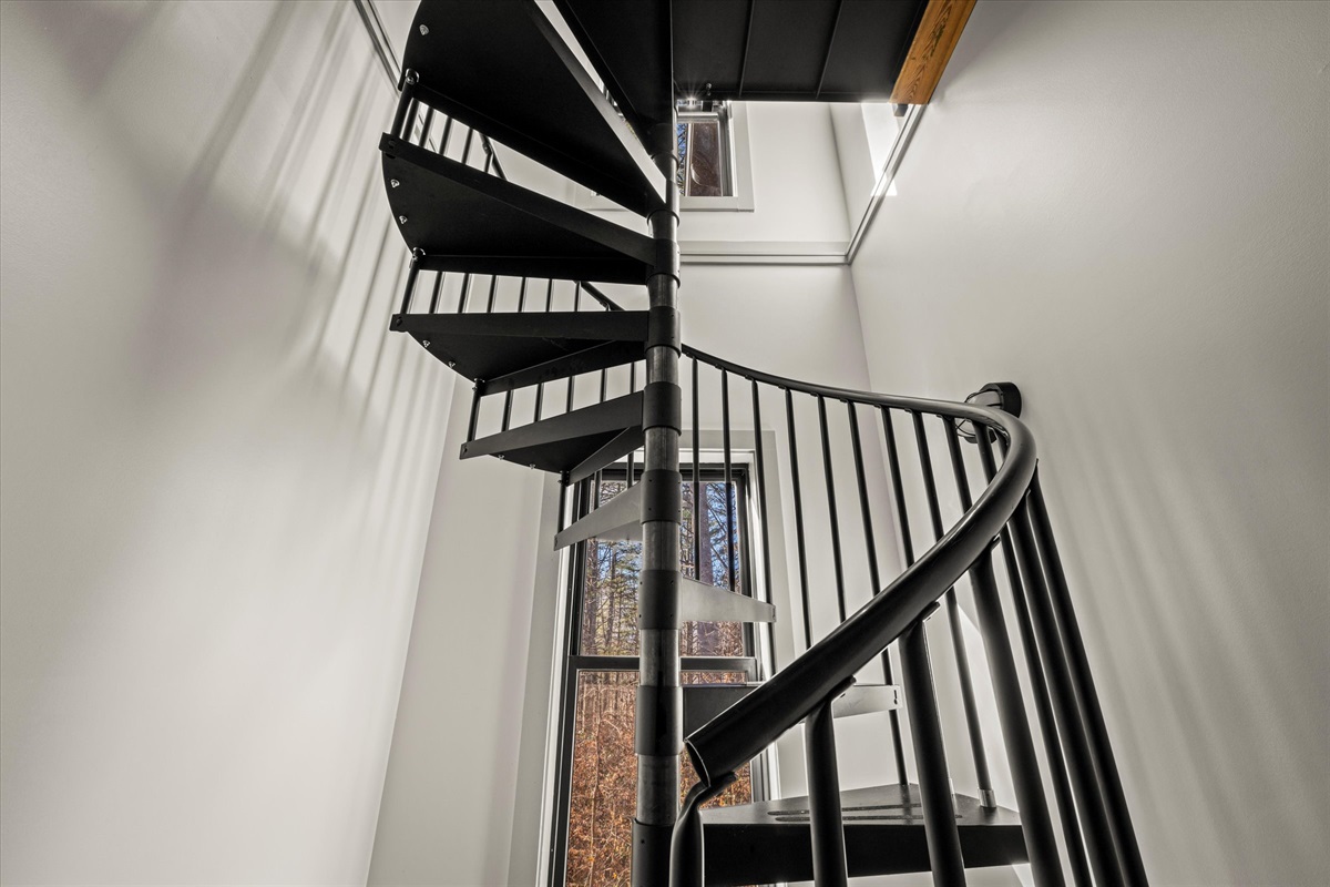 Spiral stairwell to the lower level of the two bedrooms