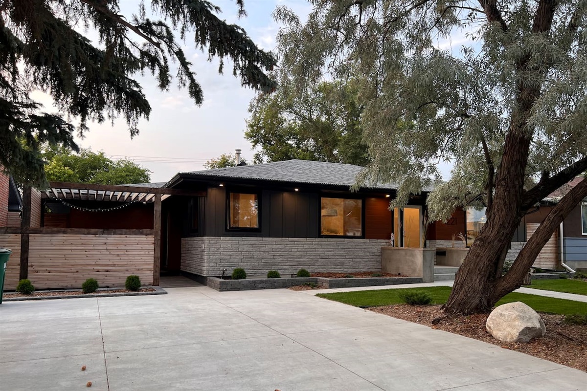 Exterior of the home — the guest suite entrance is through the pergola on the left.