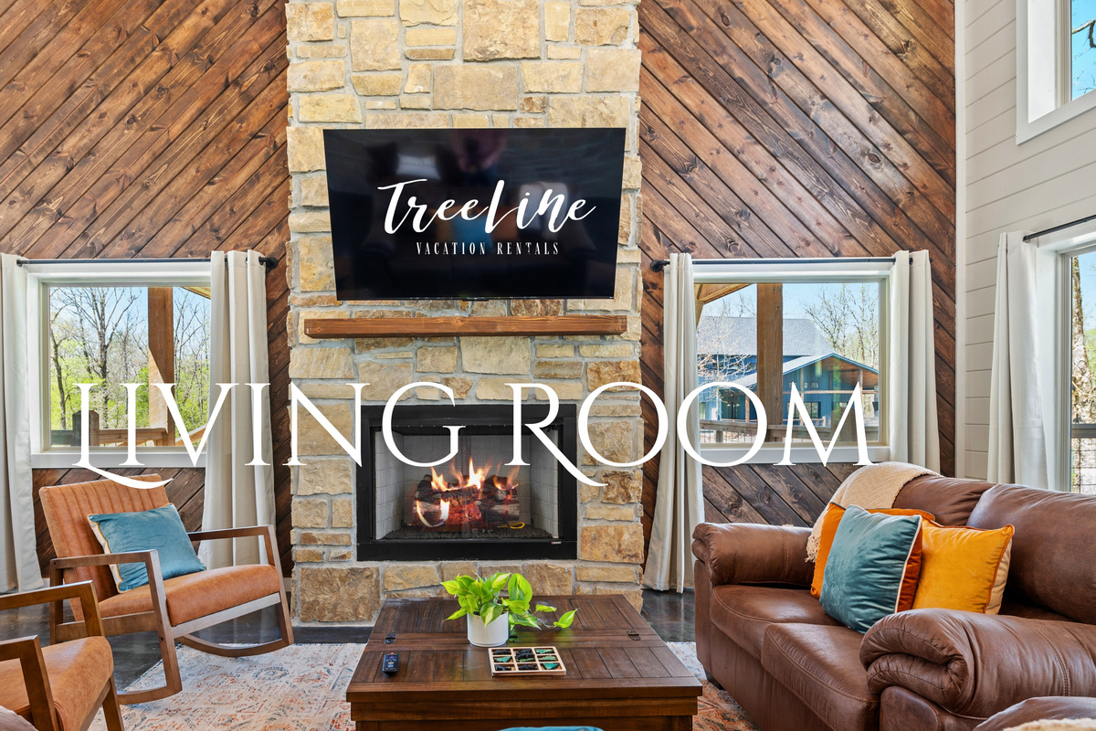Large windows let in ample natural light and provide views of the surrounding greenery, enhancing the connection with nature.