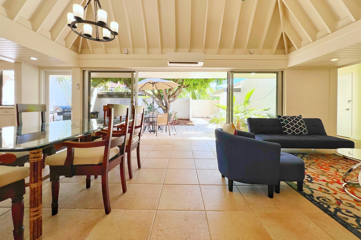 Natural light pours in, enhancing the modern yet cozy aesthetic of the living room.