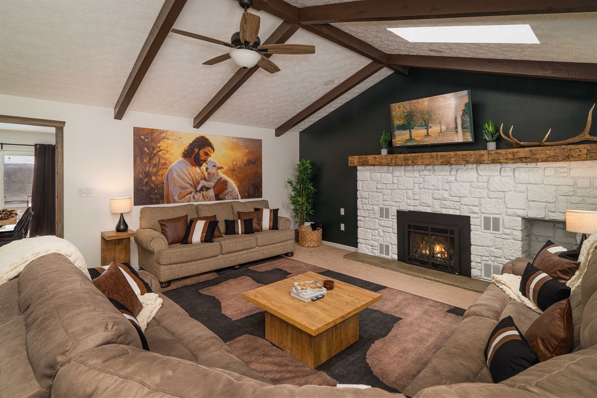Large, Stylish Living Room with Seating for the Whole Group Modern farmhouse design, gas fireplace, and 55” TV for gathering together.