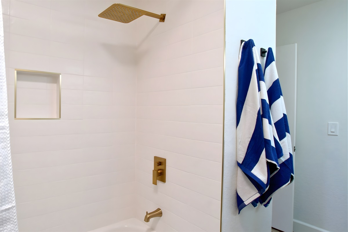 Second bathroom features a tub and a shower