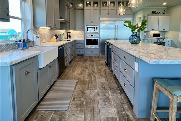 Crystal Paradise Kitchen: Bright, open kitchen featuring luxurious marble surfaces and generous space for gatherings.