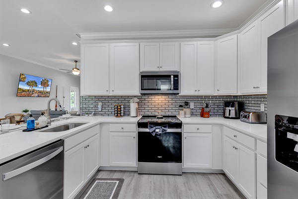 Welcome to our fully-equipped kitchen, where culinary adventures await. From morning coffees to gourmet dinners, every meal is a delight with all the essentials at your fingertips. Unleash your inner chef and savor the joy of cooking in this vibrant space.