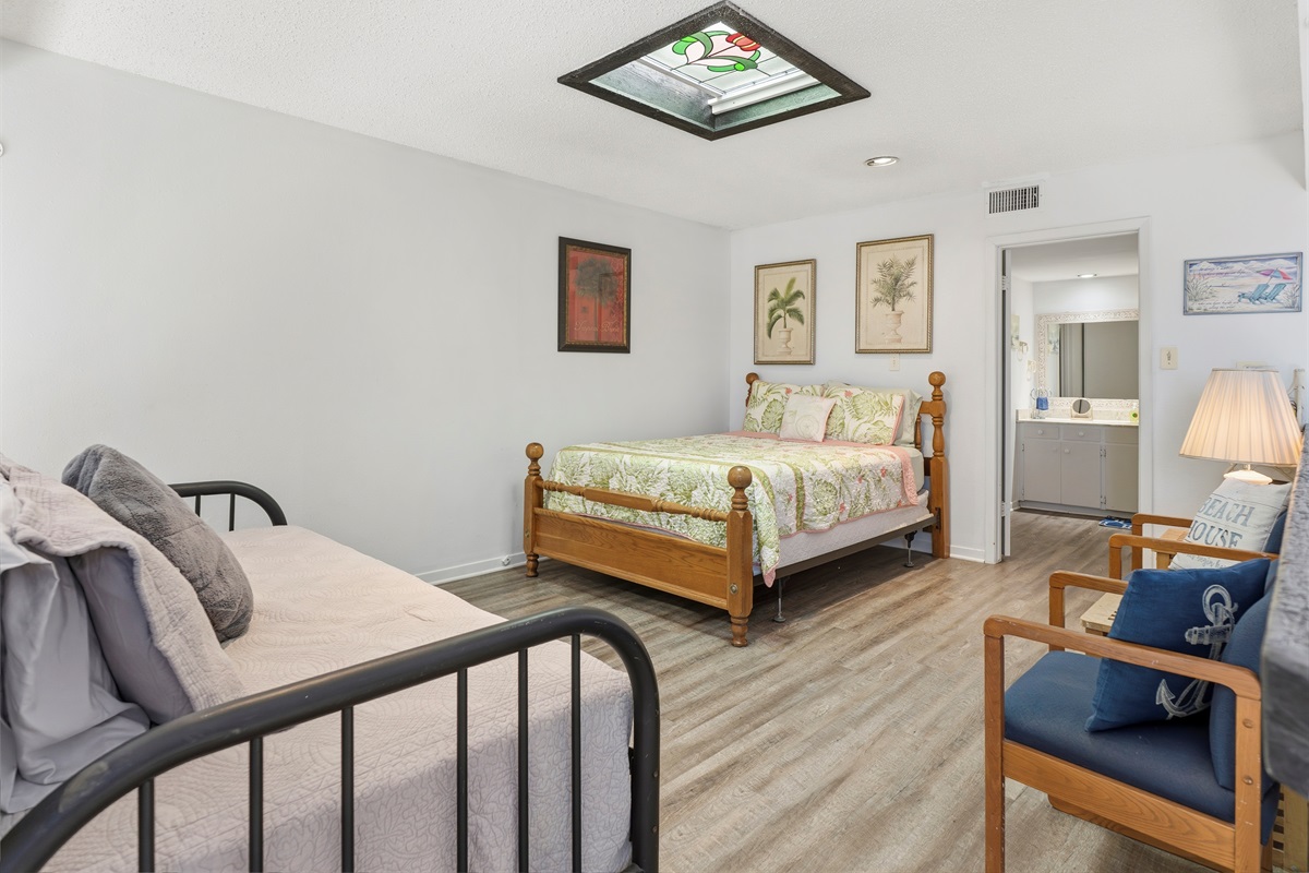king bed and twin bed in loft area