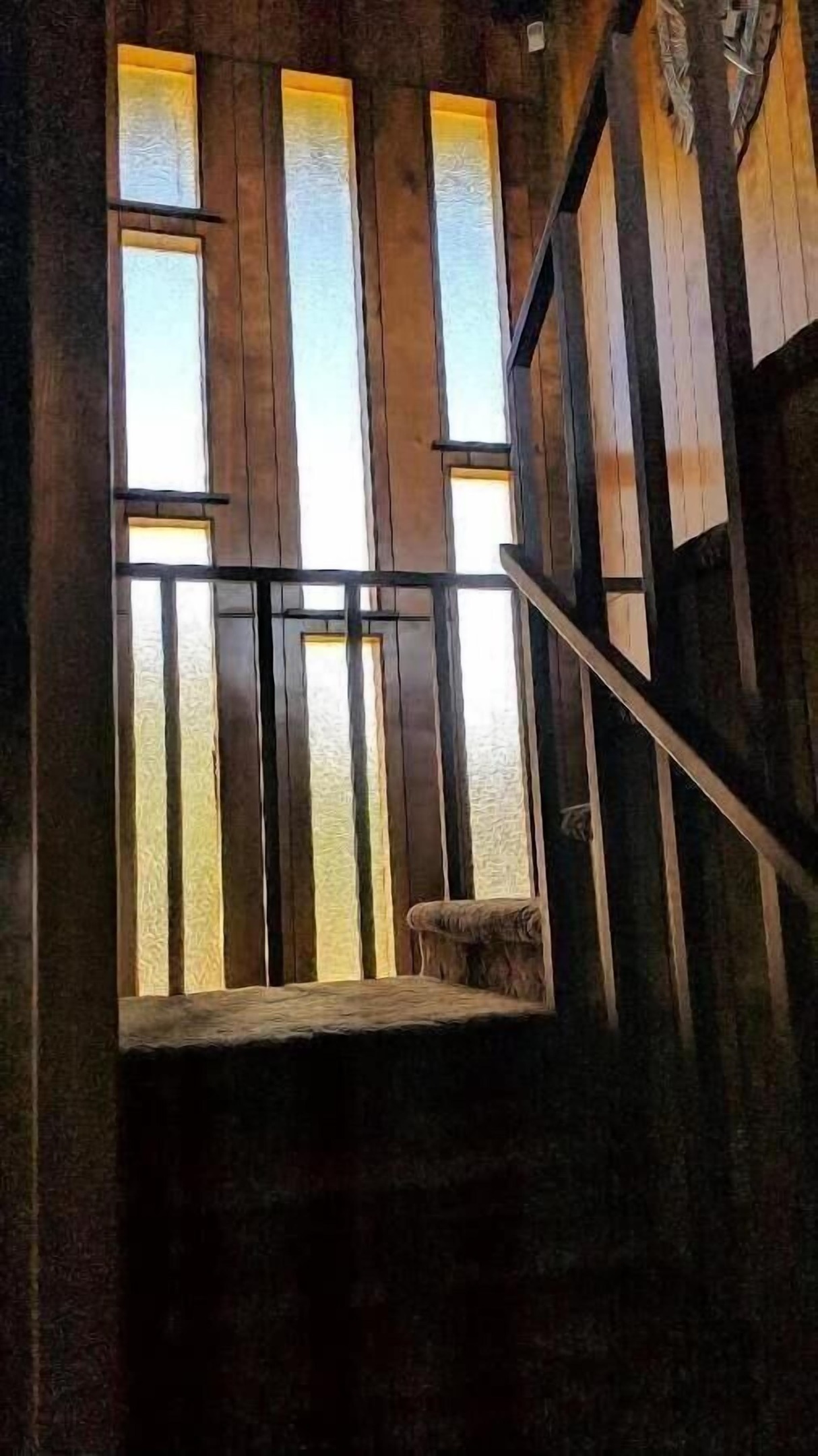 wall of glass that lights up stairway