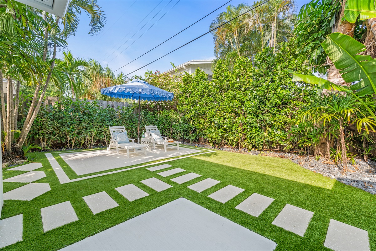Our unique checkered turf backyard offers a clean, modern space for outdoor fun