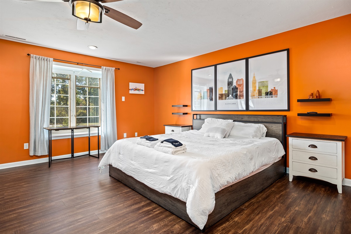 King size bed and custom mural in the "Cleveland Room"