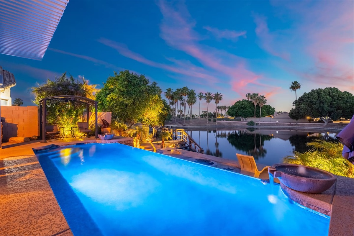 Float in the pool as the sun dips below the horizon and the lake shimmers behind the palms — evenings out here feel like a private resort experience.