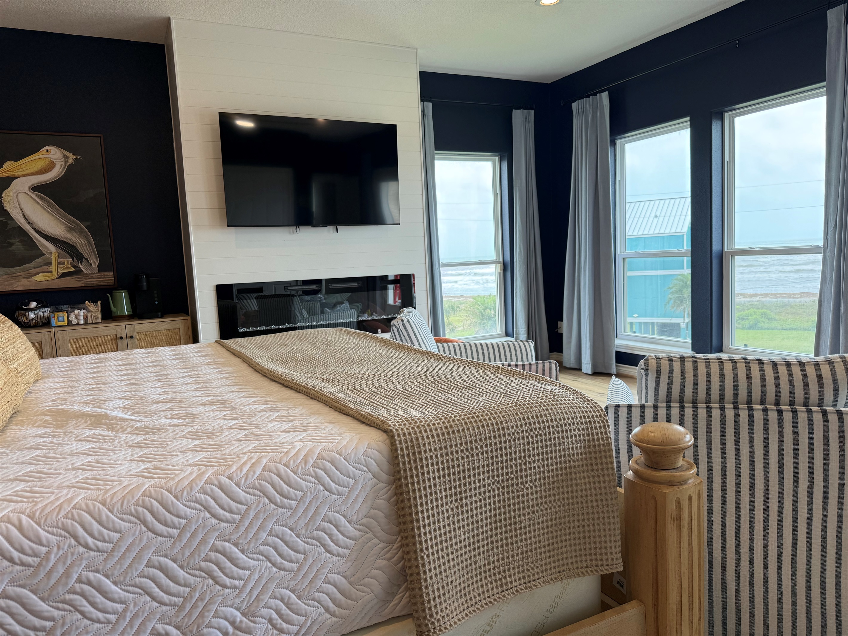 Beautiful bedroom suite for relaxing and watching the waves. Access to your deck is right outside for morning coffee. 