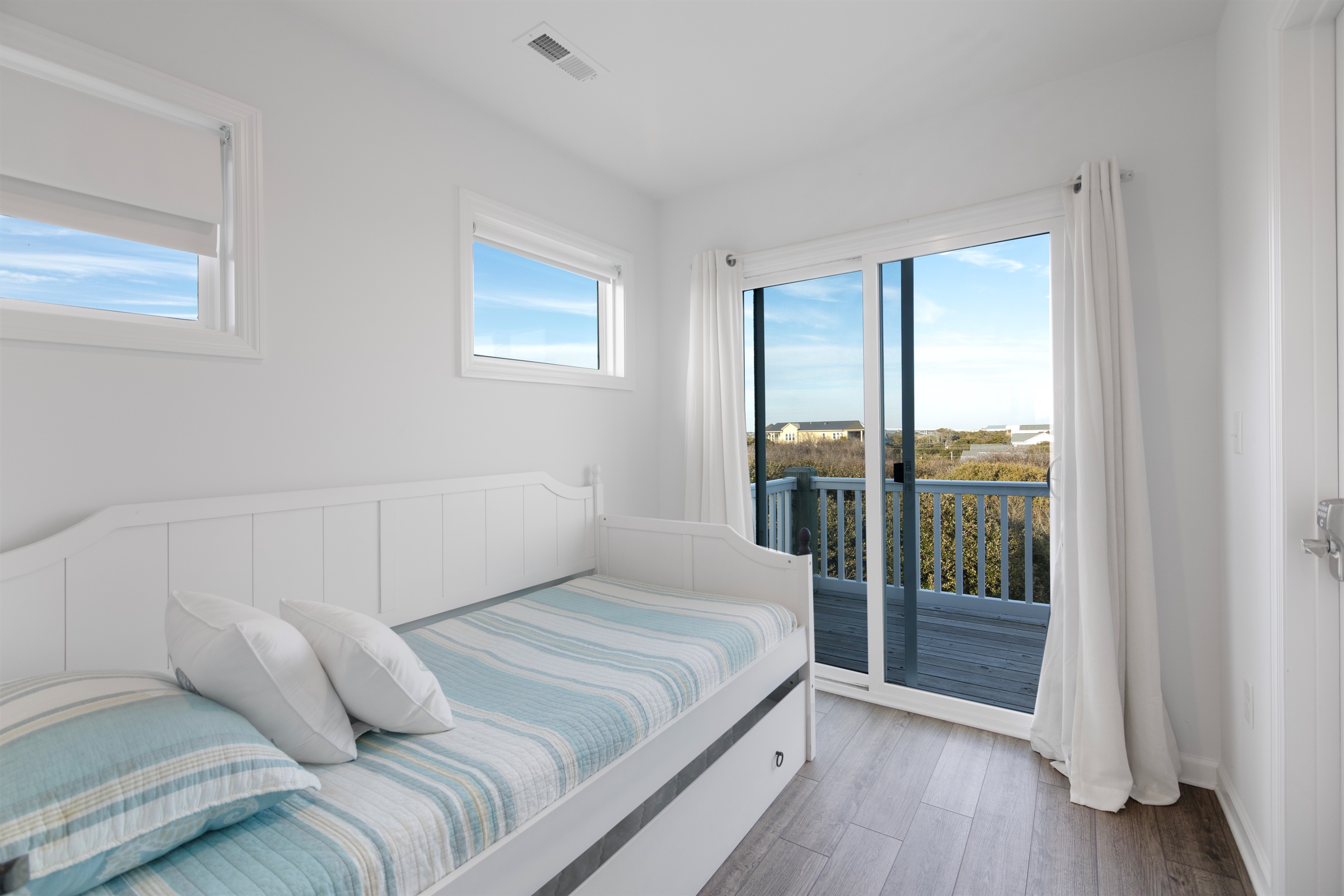 Extra sleeping space off of the top floor king suite offers a twin bed with pull-out trundle