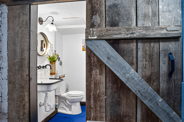 For your convenience, a half bath off the hot tub patio and next to The Speakeasy Bar.