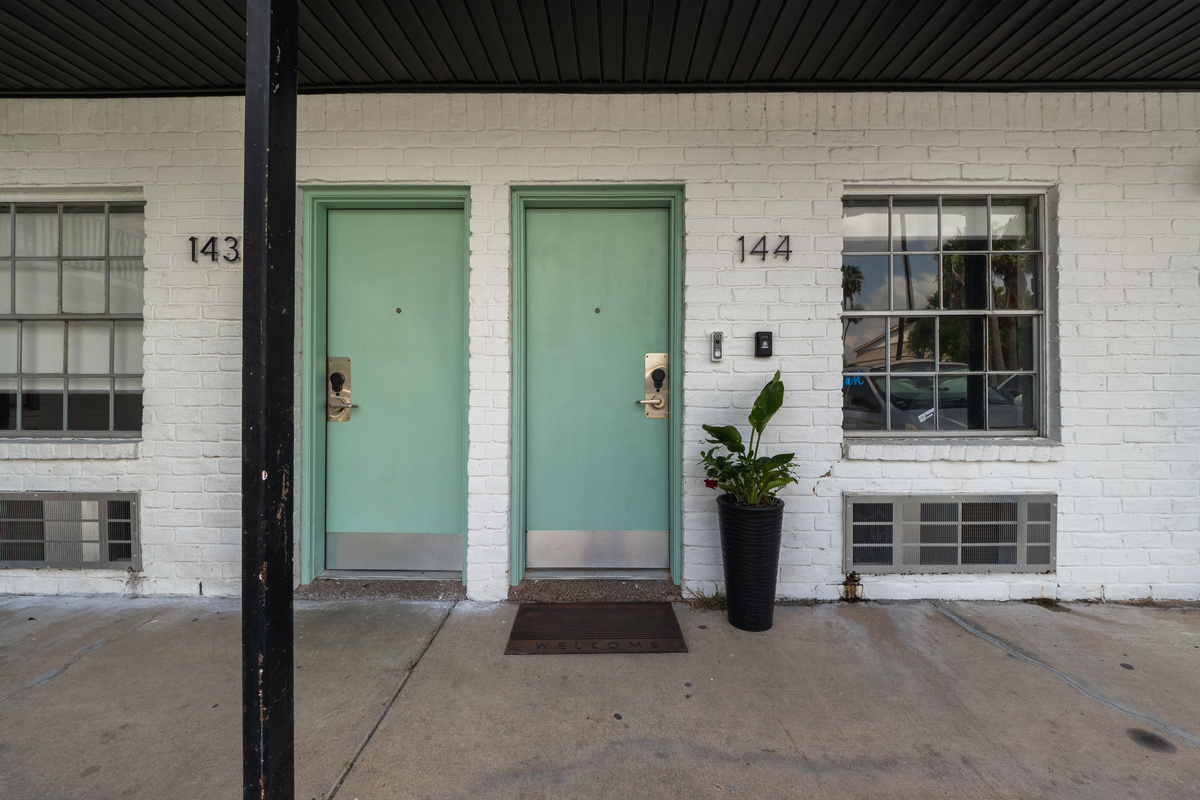 Front entry for Unit 144 with covered access and a simple path to the door.
