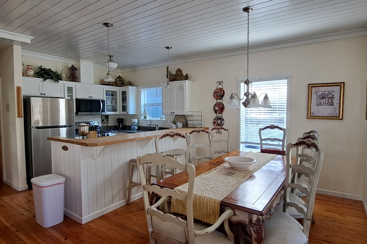Gather around the French-Country table for 8, with additional seating at the kitchen island for family and friends.