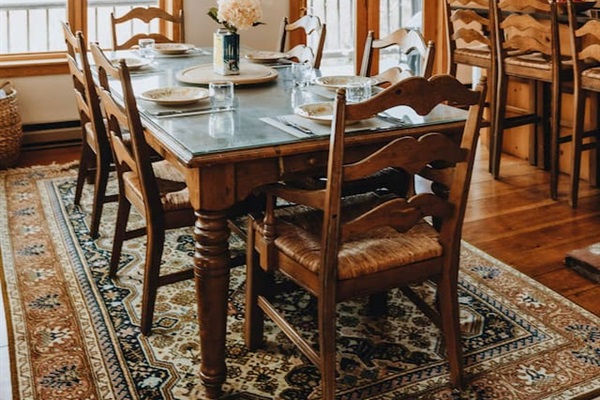 The dining area off of the kitchen with seats 6 at the table and 3 at the counter.