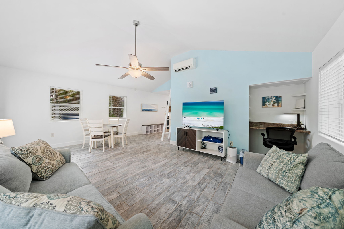 Bright, open living space with a vaulted ceiling and plenty of natural light