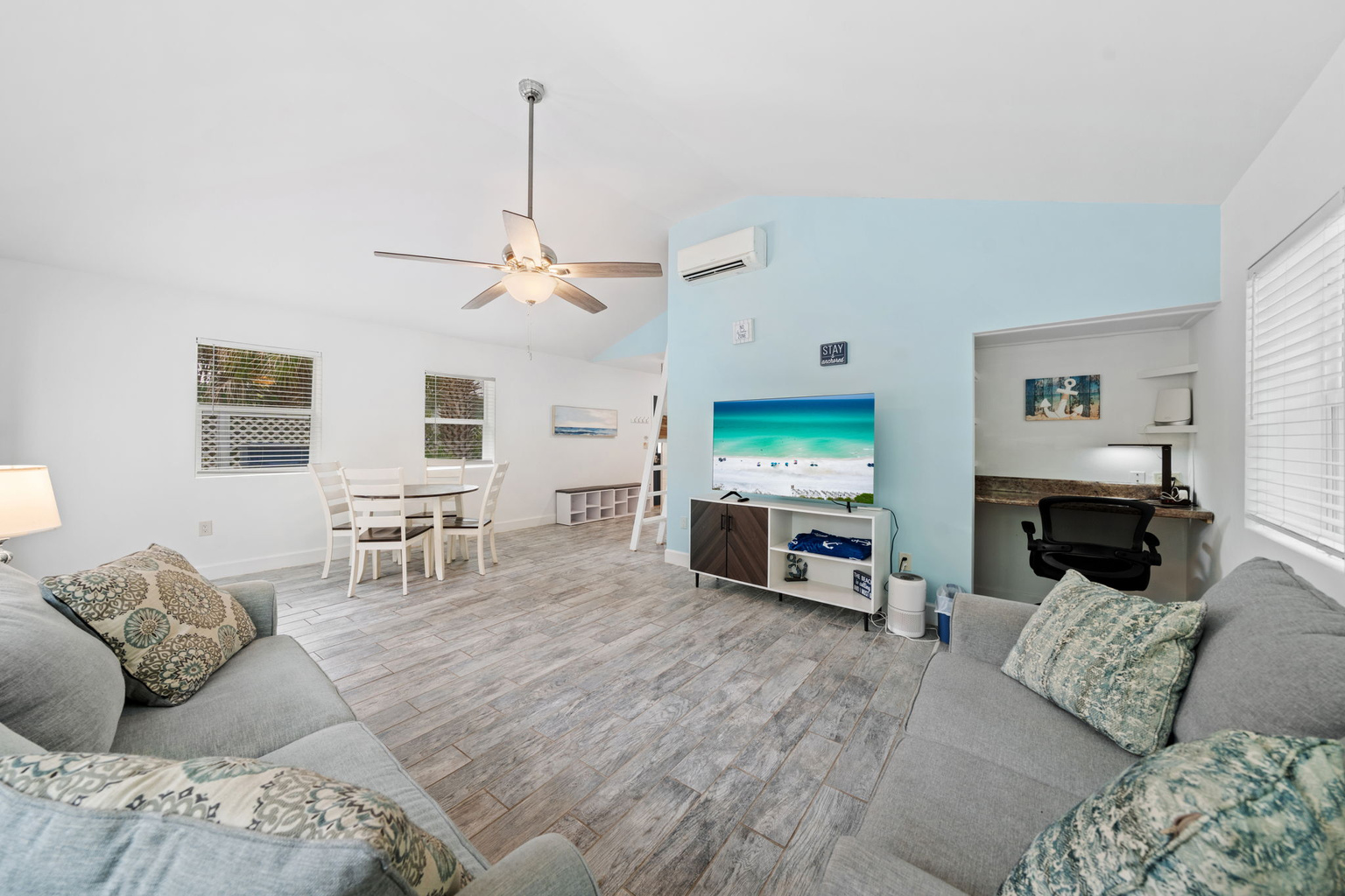 Bright, open living space with a vaulted ceiling and plenty of natural light