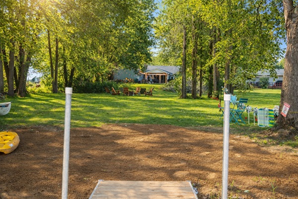 Sun pouring through the trees, Adirondack chairs ready for stories by the fire, and the cottage glowing in the background — this is what summer evenings at Crowe River Retreat are made of. Just add family, laughter, and 