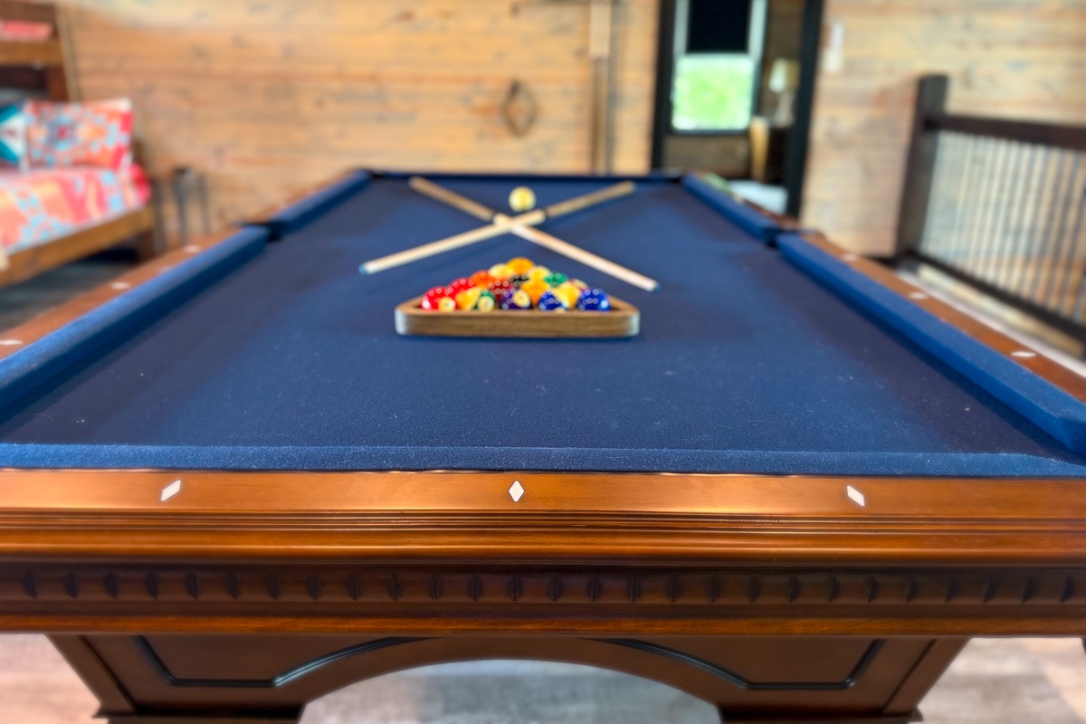 Full size pool table in game room for hours of fun!