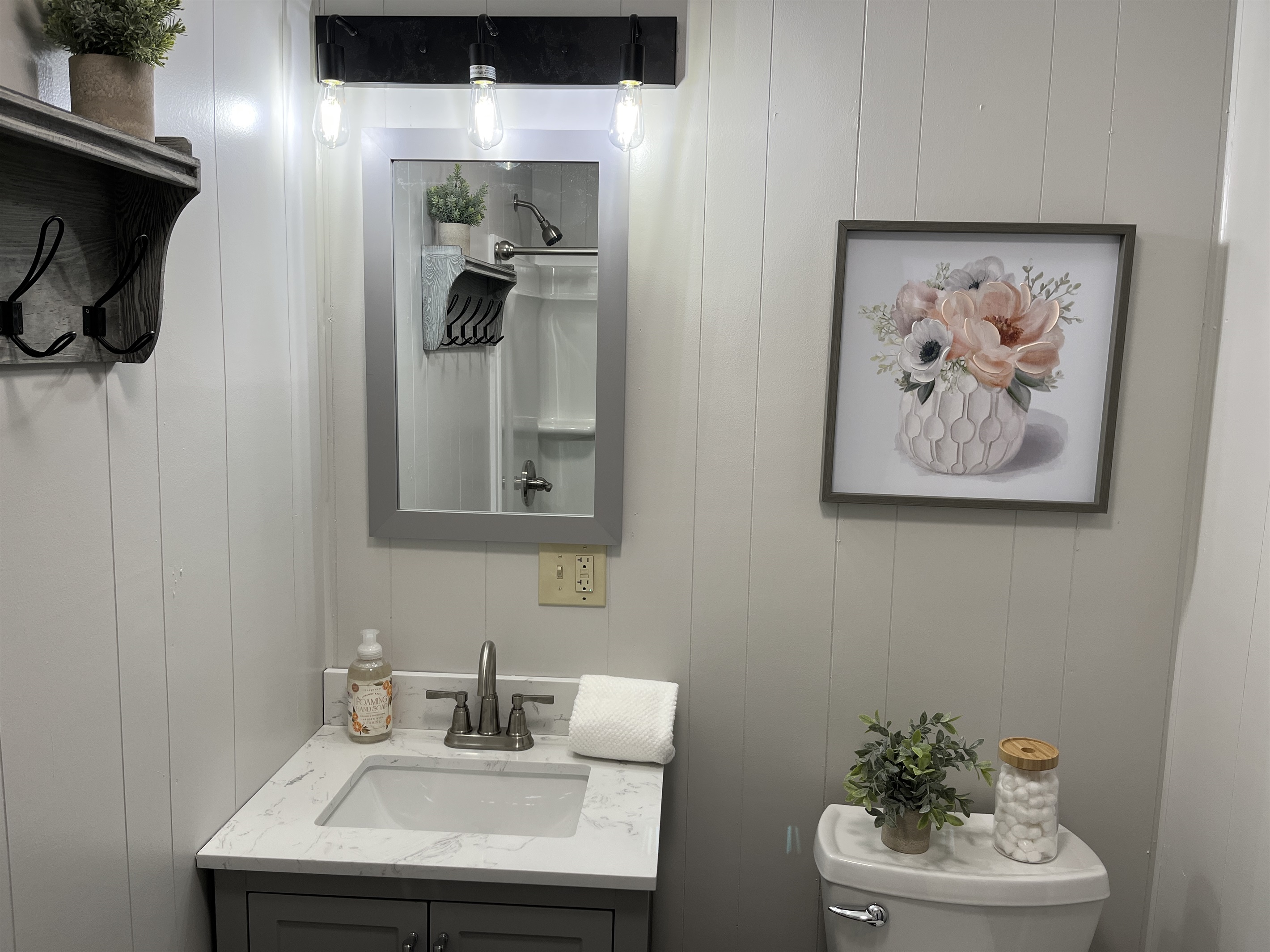 Renovated bath with tub shower off hallway