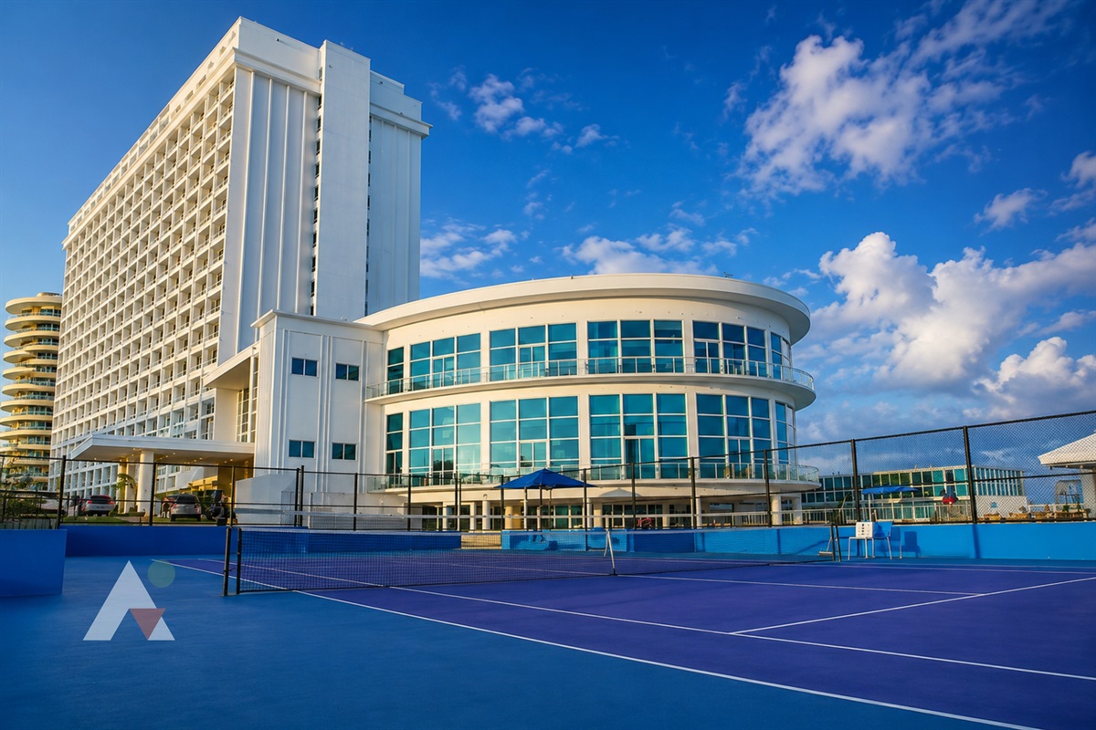 The building's outdoor tennis court, with ocean breezes and skyline views; court time is reserved at the front desk.