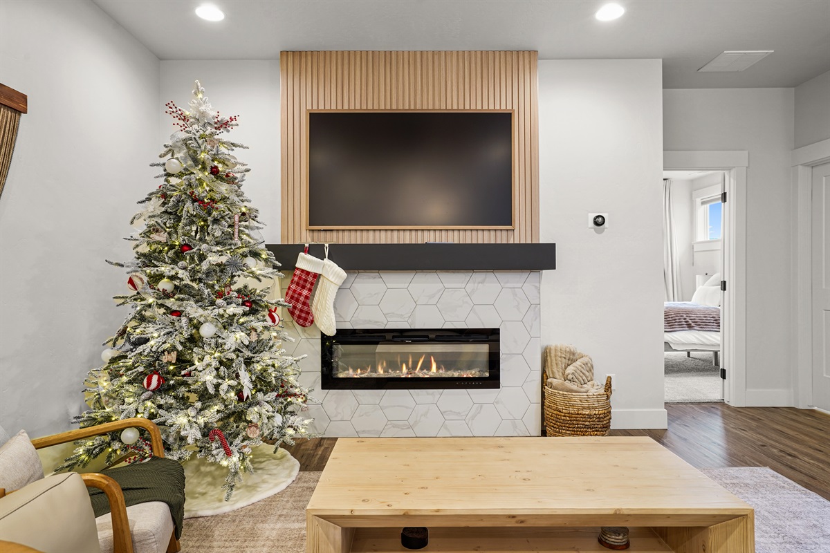 Relax by the warm fireplace and enjoy festive holiday decorations.
