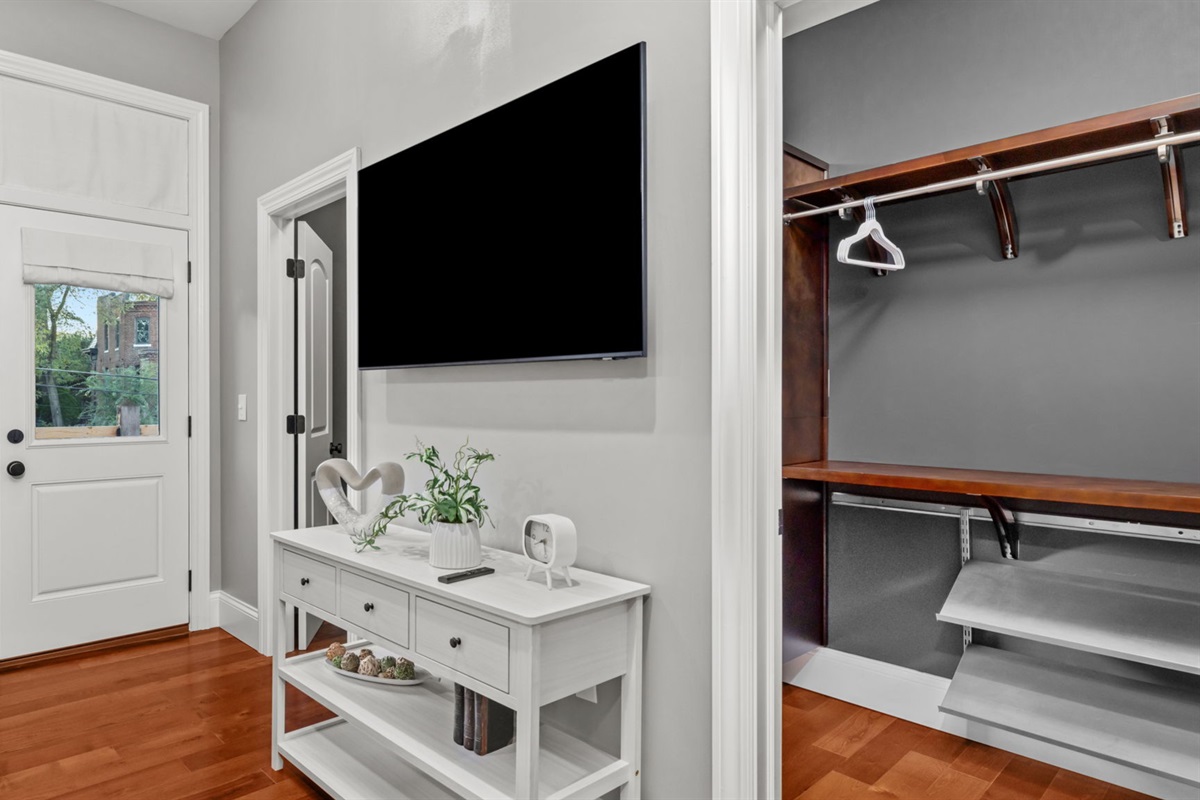 Walk-in closet provides ample space for storing your personal items, and there is easy access to the private balcony overlooking the back yard.