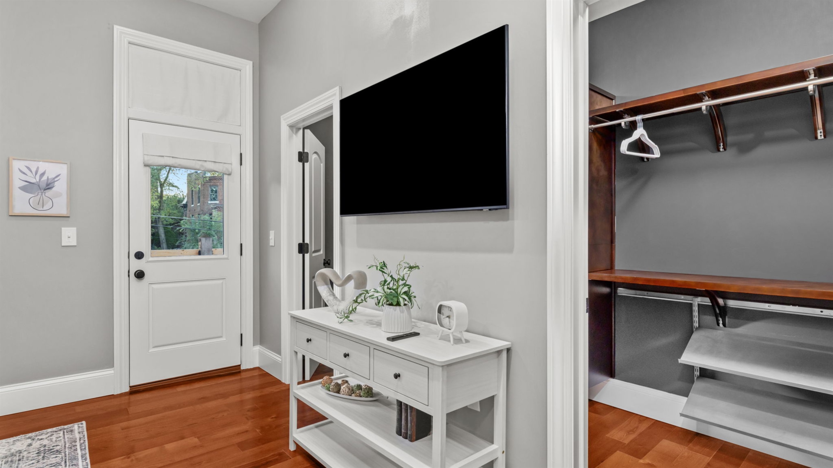 Walk-in closet provides ample space for storing your personal items, and there is easy access to the private balcony overlooking the back yard.