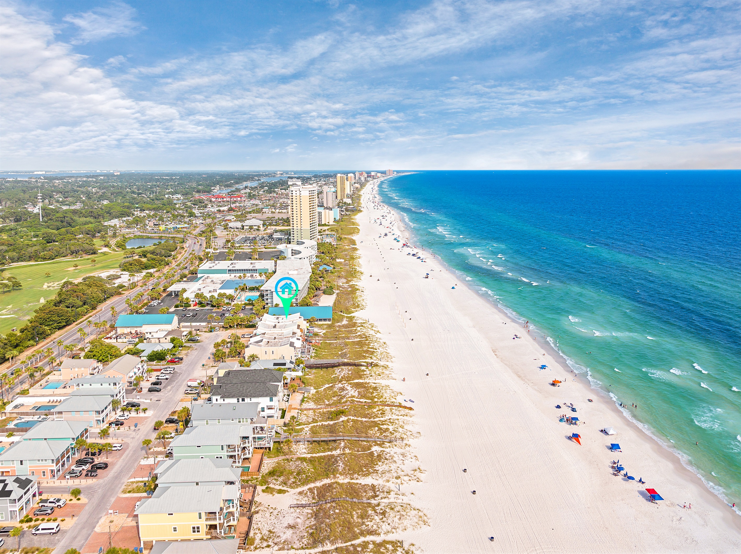Aerial view of the beautiful beachfront property, highlighting its prime location and scenic surroundings.