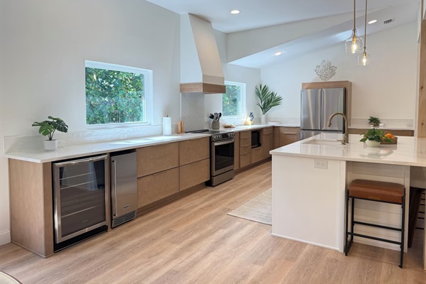Meticulously designed kitchen with high end appliances and gold-veined Quartz