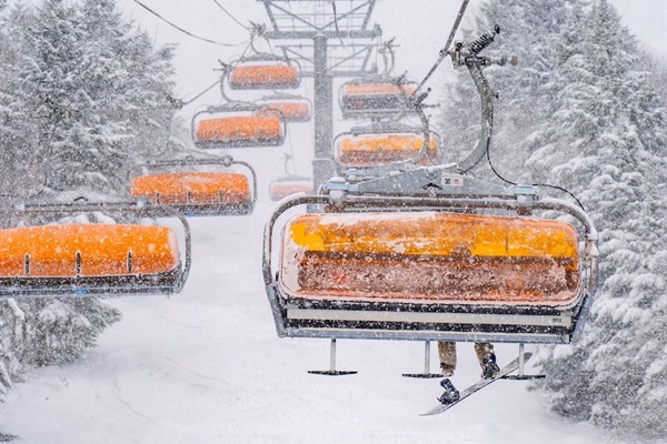 Hop on the chairlifts and soar above the slopes, ready for your next thrilling run down the mountain!